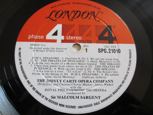 Royal Philharmonic Orchestra Conducted By Sir Malcolm Sargent And D'oyly Carte Opera Company, Gilbert & Sullivan : Gilbert & Sullivan Spectacular - Selections From H. M. S. Pinafore, The Mikado, The Pirates Of Penzance And Ruddigore (LP, Gat)