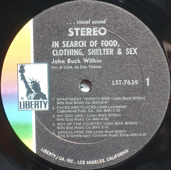 John Buck Wilkin : In Search Of Food Clothing Shelter And Sex (LP, Album)