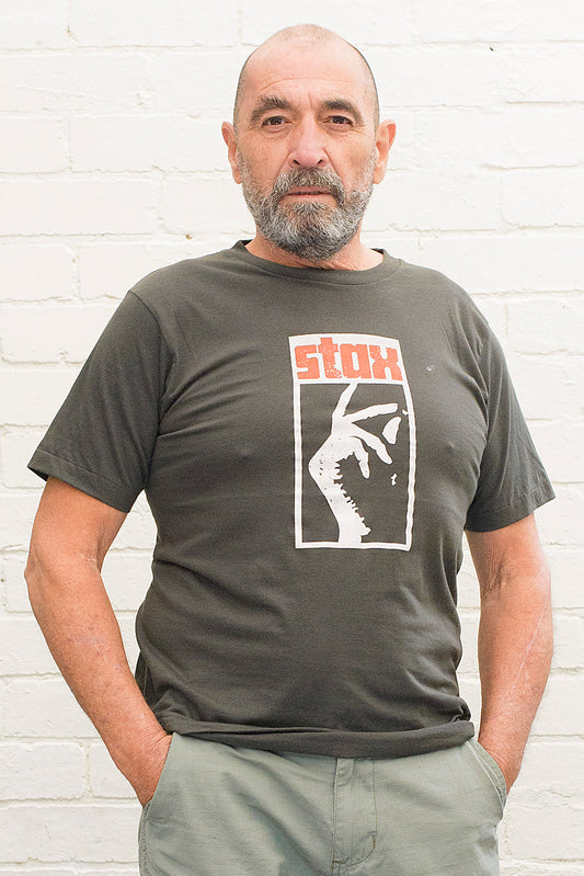 model wearing black cotton t-shirt with stax record label logo printed on front