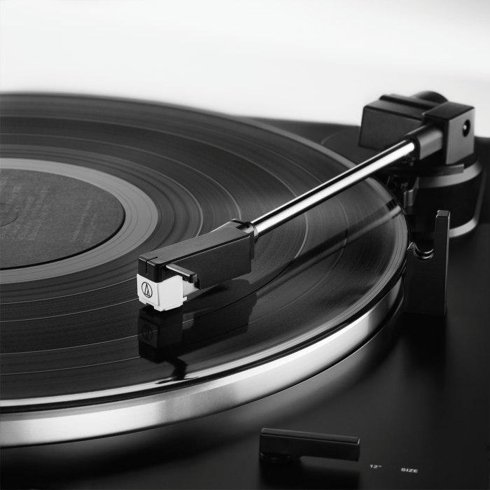 audio technica LP60xbt usb and bluetooth turntable in black close up of arm and cartridge